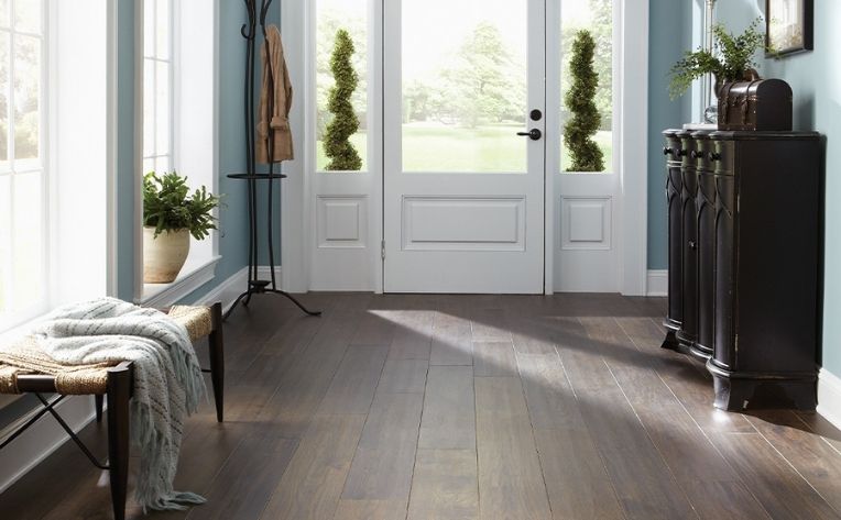 engineered hardwood flooring in entryway with contemporary furniture.